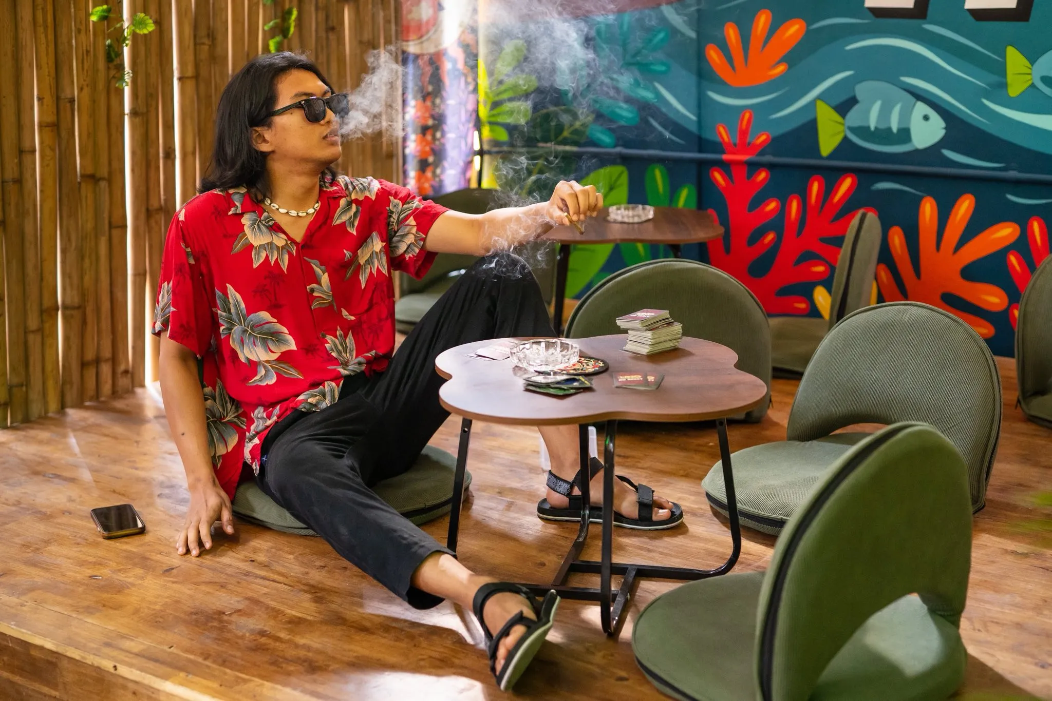 Relaxed lounge seating and hand-painted mural inside The Hub