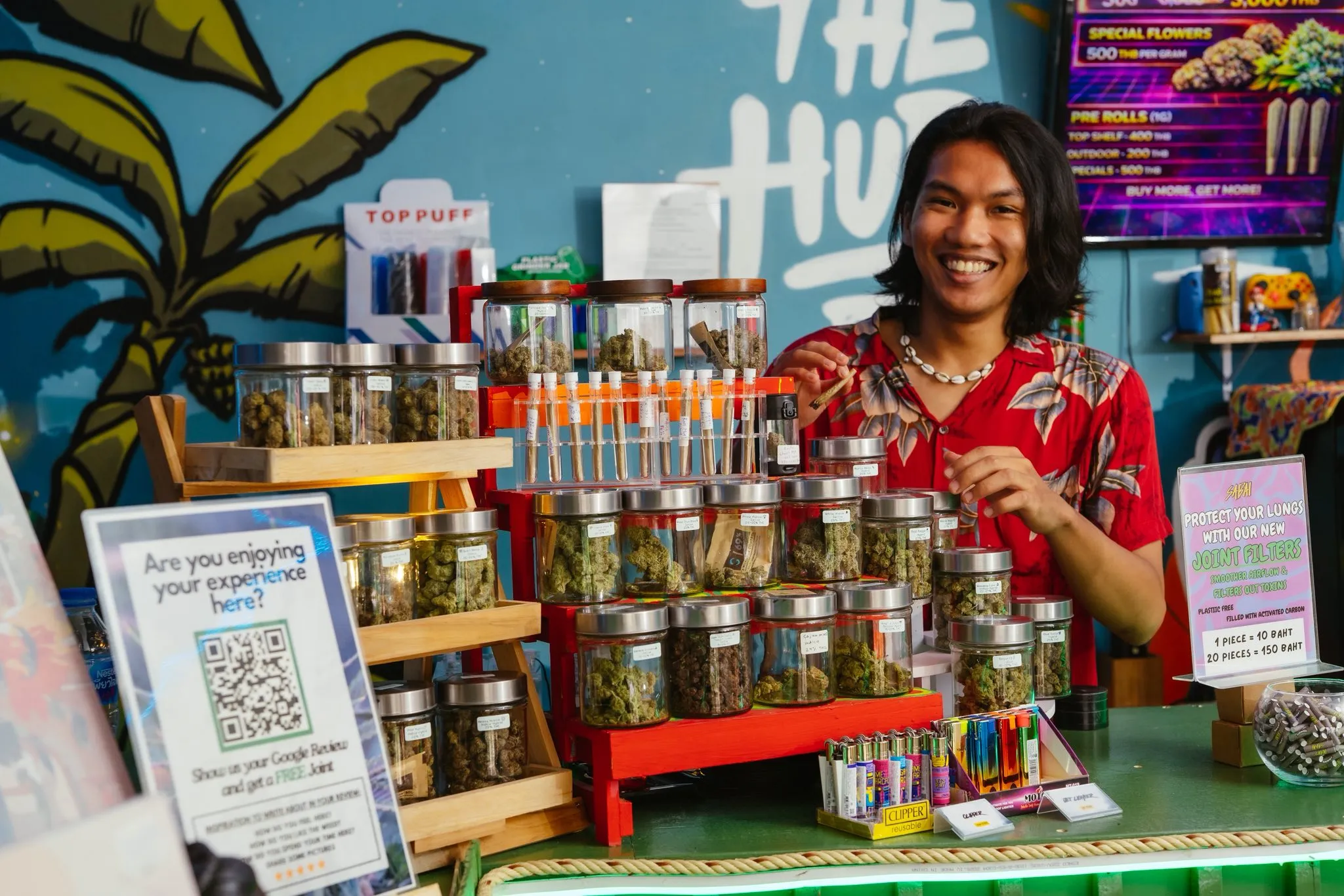 The Hub team welcoming guests at the cannabis counter in Ao Nang, Krabi